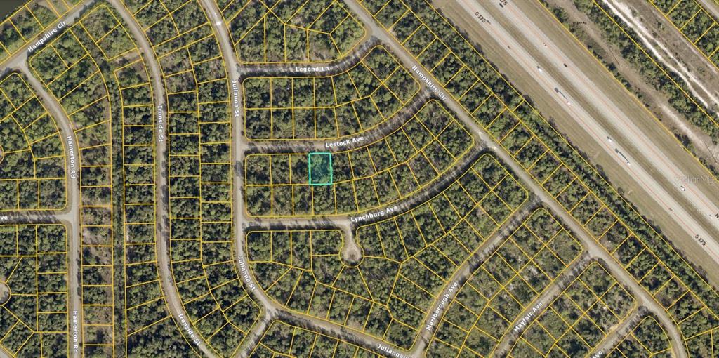 This is an aerial map showing a highlighted vacant lot in a residential neighborhood — 1132212704 LESTOCK AVENUE, NORTH PORT, FL
