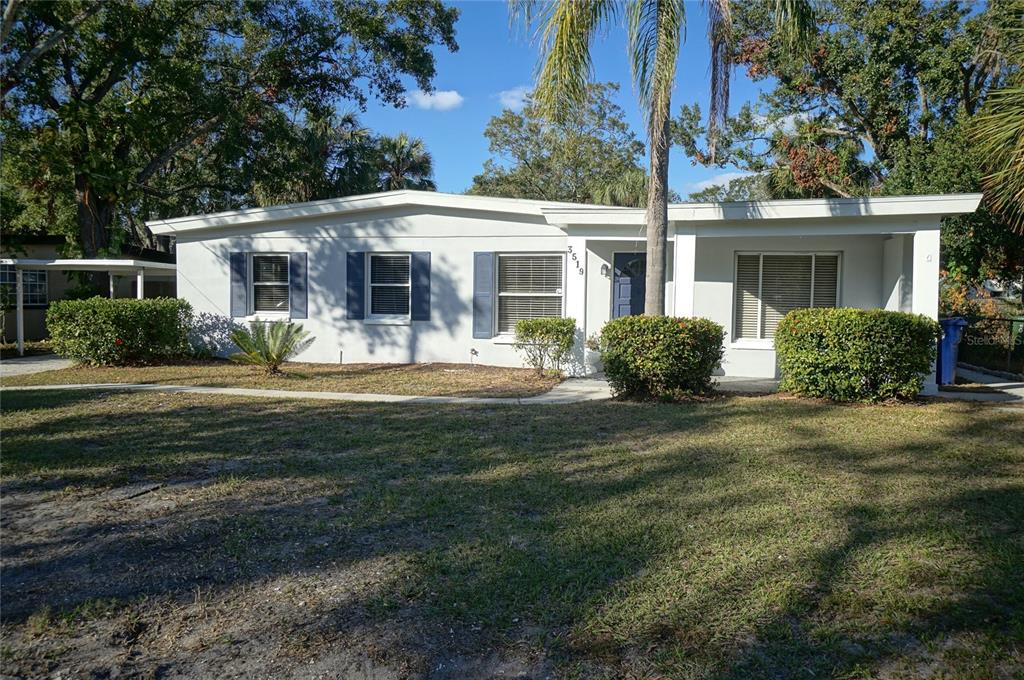 A single-story white house with blue shutters and a covered front porch — 3519 W PRICE AVENUE, TAMPA, FL