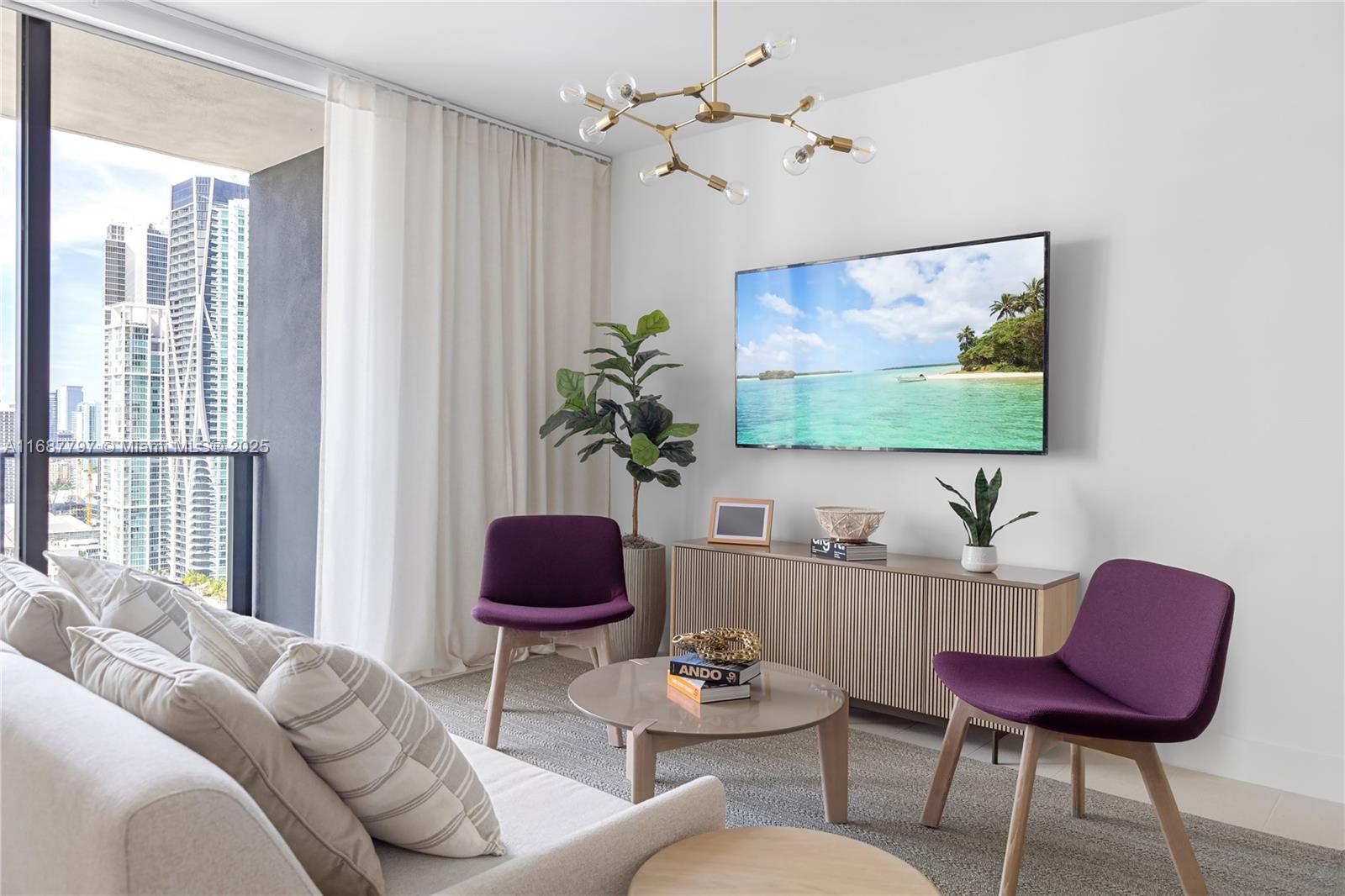 A modern living room features purple chairs, a round coffee table, and a city view — 159 NE 6TH ST # 3002, Miami FL 33132, MIAMI, FL