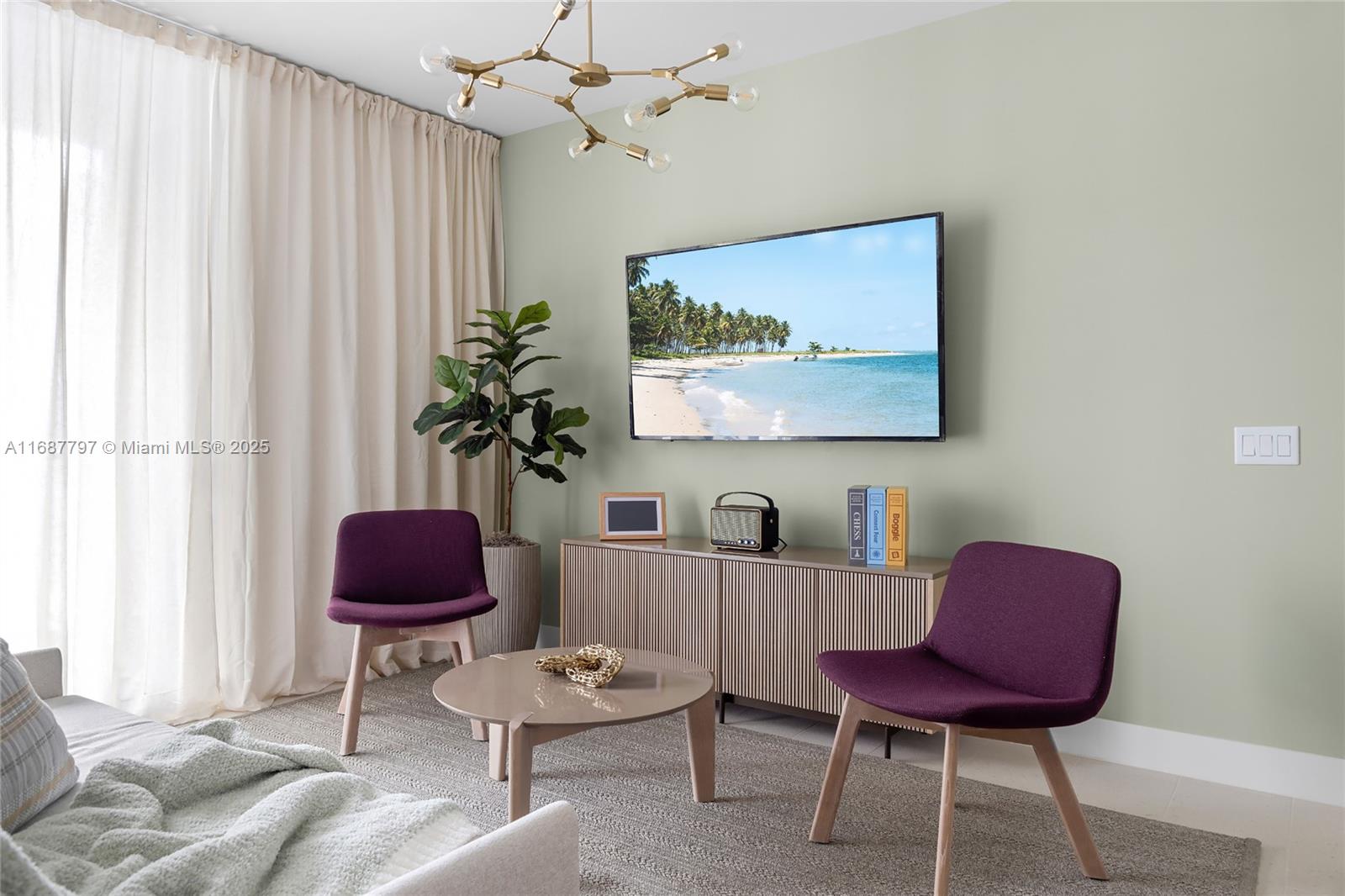 A living room features two purple chairs, a round coffee table, and a wall-mounted television — 159 NE 6TH ST # 3002, Miami FL 33132, MIAMI, FL
