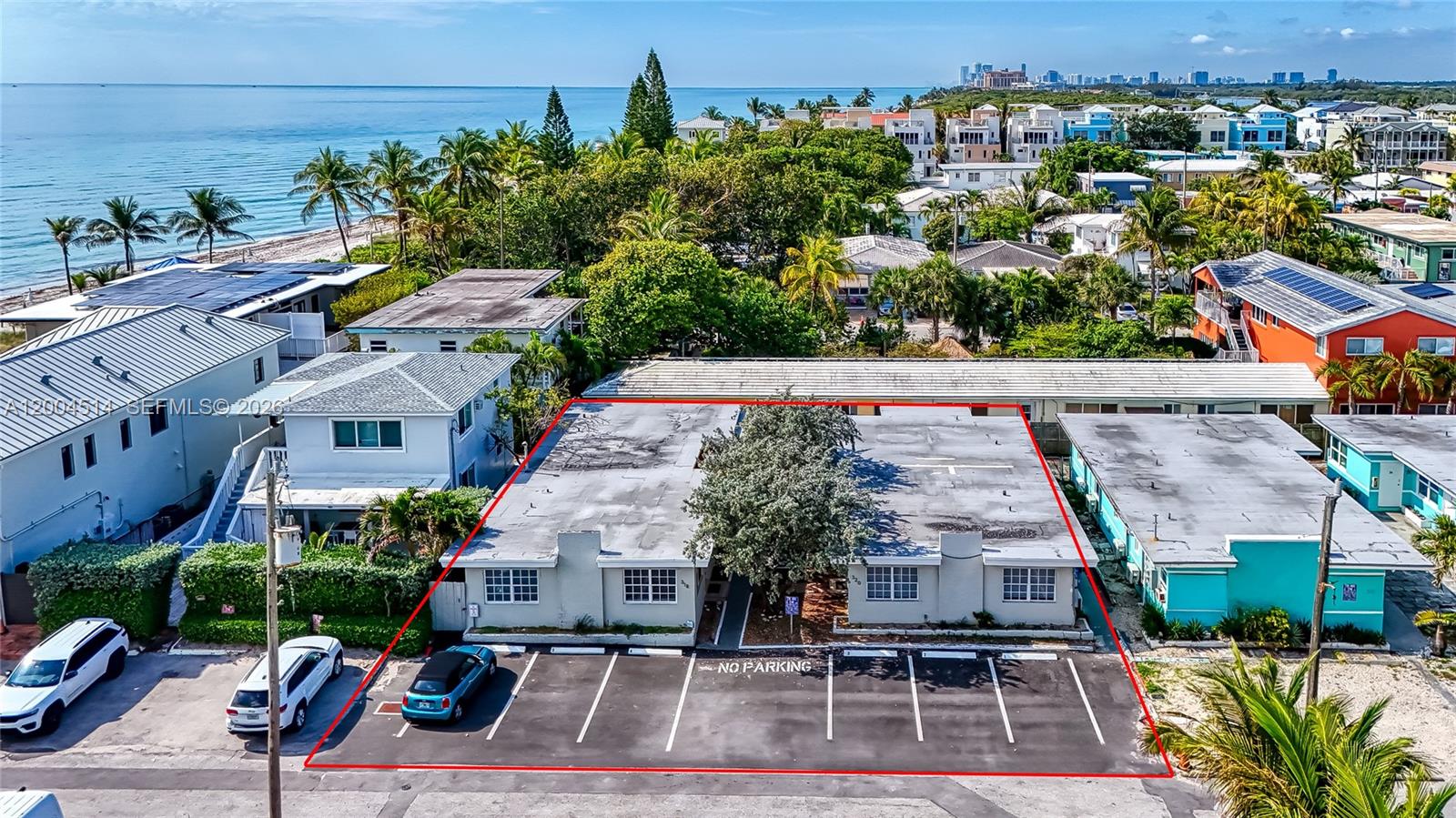 An aerial view shows a single-story multi-unit building with a parking lot in front — 318 Walnut St, Hollywood FL 33019, HOLLYWOOD, FL