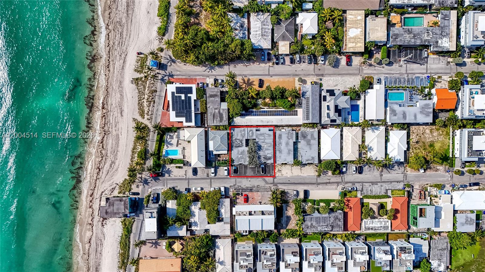 This aerial view shows a coastal neighborhood with a red-outlined building and parking area — 318 Walnut St, Hollywood FL 33019, HOLLYWOOD, FL