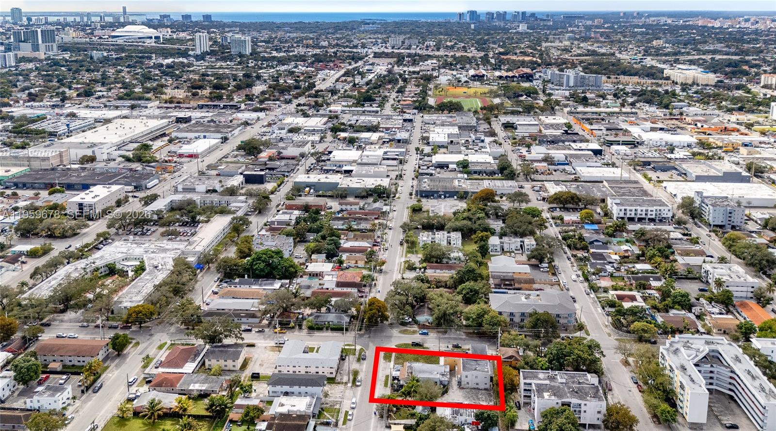 An aerial view shows a rectangular property lot outlined in red within a suburban neighborhood — 2616 NW 23rd Ave, Miami FL 33142, MIAMI, FL