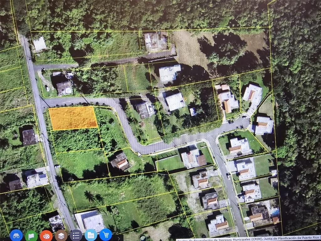 An aerial map view shows a highlighted vacant residential lot within a suburban neighborhood — BO. GUERRERO MANSIONES DEL CIELO, AGUADILLA, PR