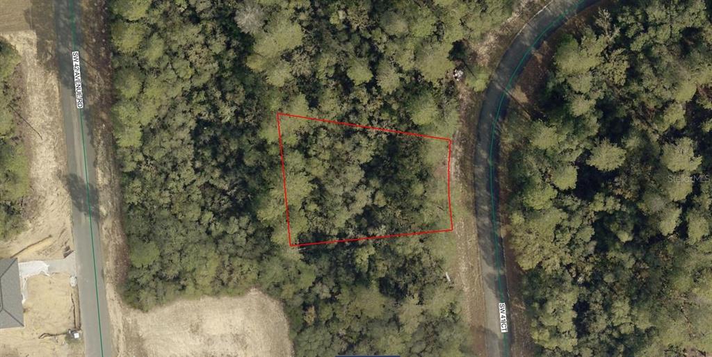 An aerial view shows a wooded, trapezoidal plot of land outlined in red between two roads — 8006-0714-12 SW 41 COURT, OCALA, FL