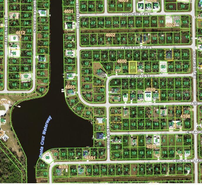 This is a map showing residential lots and streets in a neighborhood near a waterway — 10185 WILDCAT STREET, PORT CHARLOTTE, FL