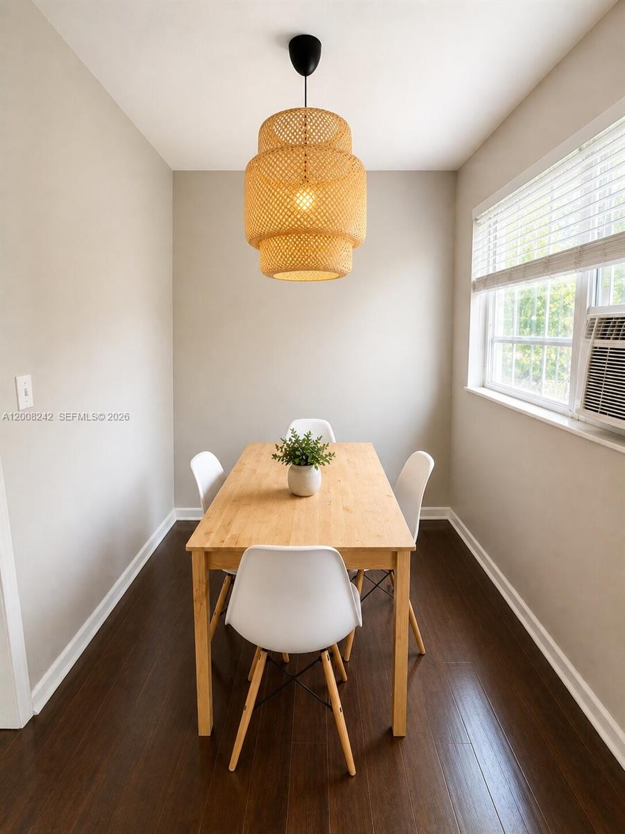 A dining area features a wooden table, four white chairs, and a woven pendant light — 375 SW 19th Ave # 2, Miami FL 33135, MIAMI, FL