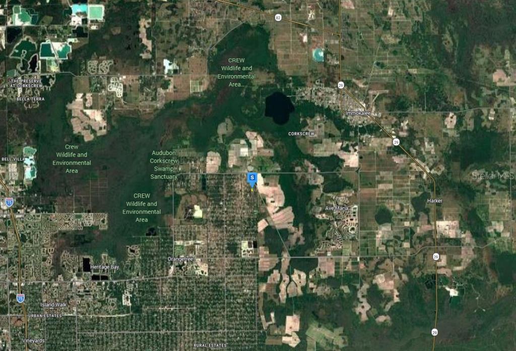 This is a satellite map showing the location of a property near protected environmental areas — 4450 66TH AVE NE, NAPLES, FL