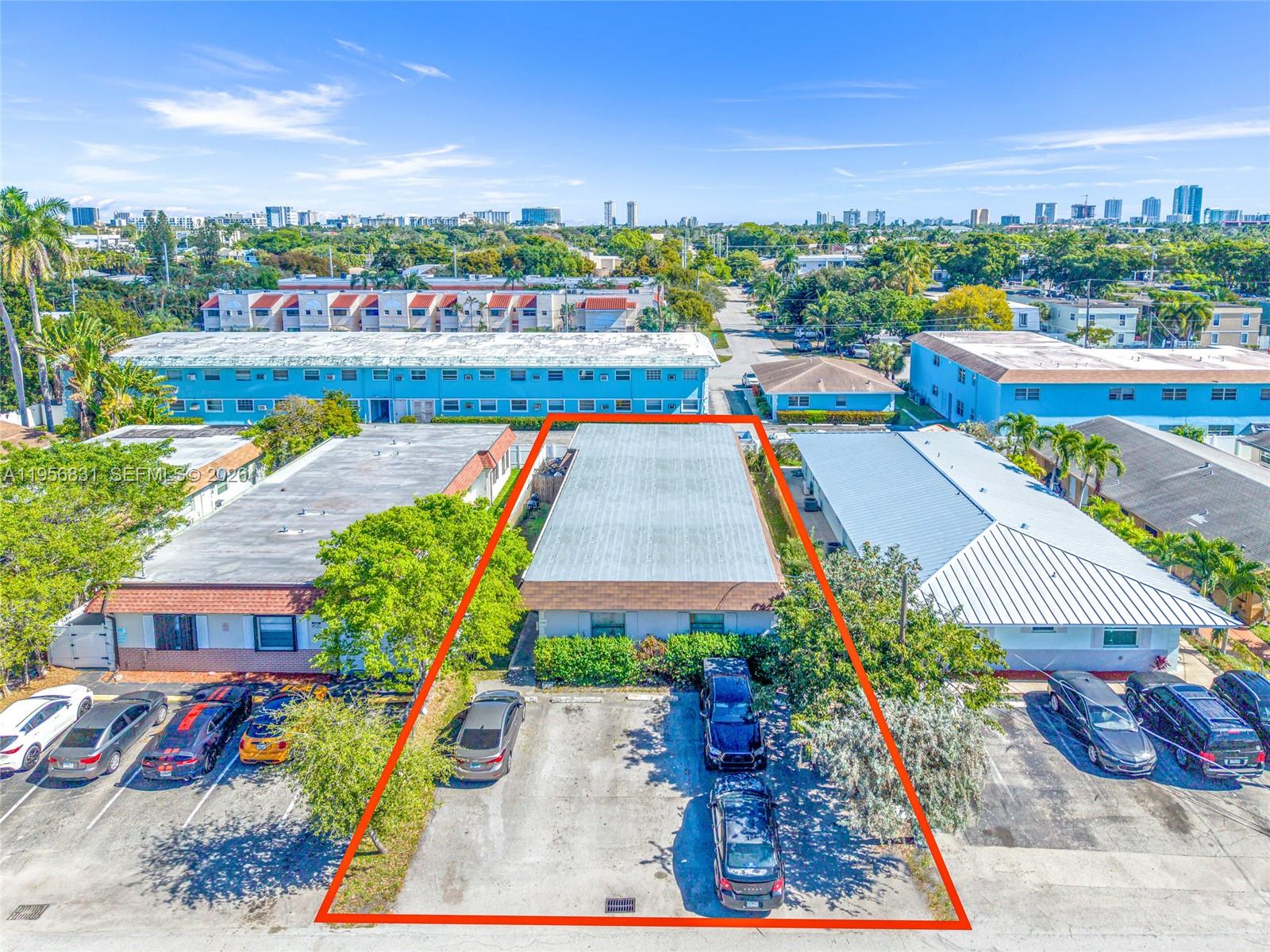 An aerial view shows a rectangular building with a flat roof and a parking lot — 240 SE 9th Ave, Pompano Beach FL 33060, POMPANO BEACH, FL