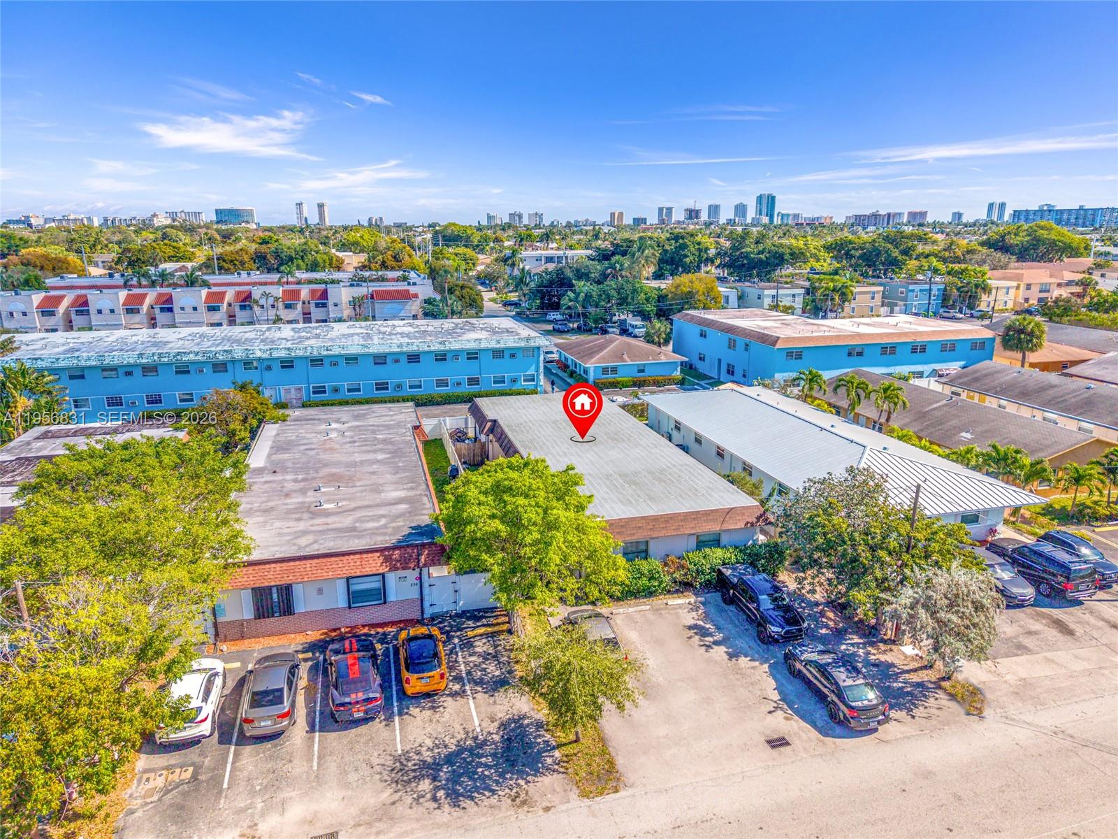 An aerial view shows a low-rise building with a red location pin on its roof — 240 SE 9th Ave, Pompano Beach FL 33060, POMPANO BEACH, FL
