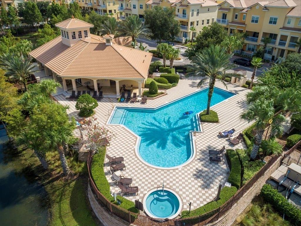 An aerial view of a community swimming pool and hot tub with surrounding lounge chairs — 1495 LAKE GEORGE DRIVE, LAKE MARY, FL