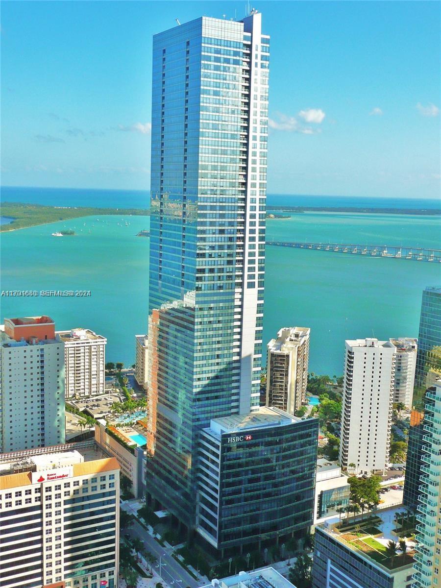 An aerial view of a tall glass skyscraper in Miami with a prominent HSBC sign — 1435 Brickell Ave # 3307, Miami FL 33131, MIAMI, FL