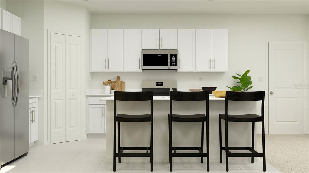 This rendering shows a kitchen with white cabinets, stainless steel appliances, and a central island — 1531 WILLOW GARDEN LOOP, EUSTIS, FL