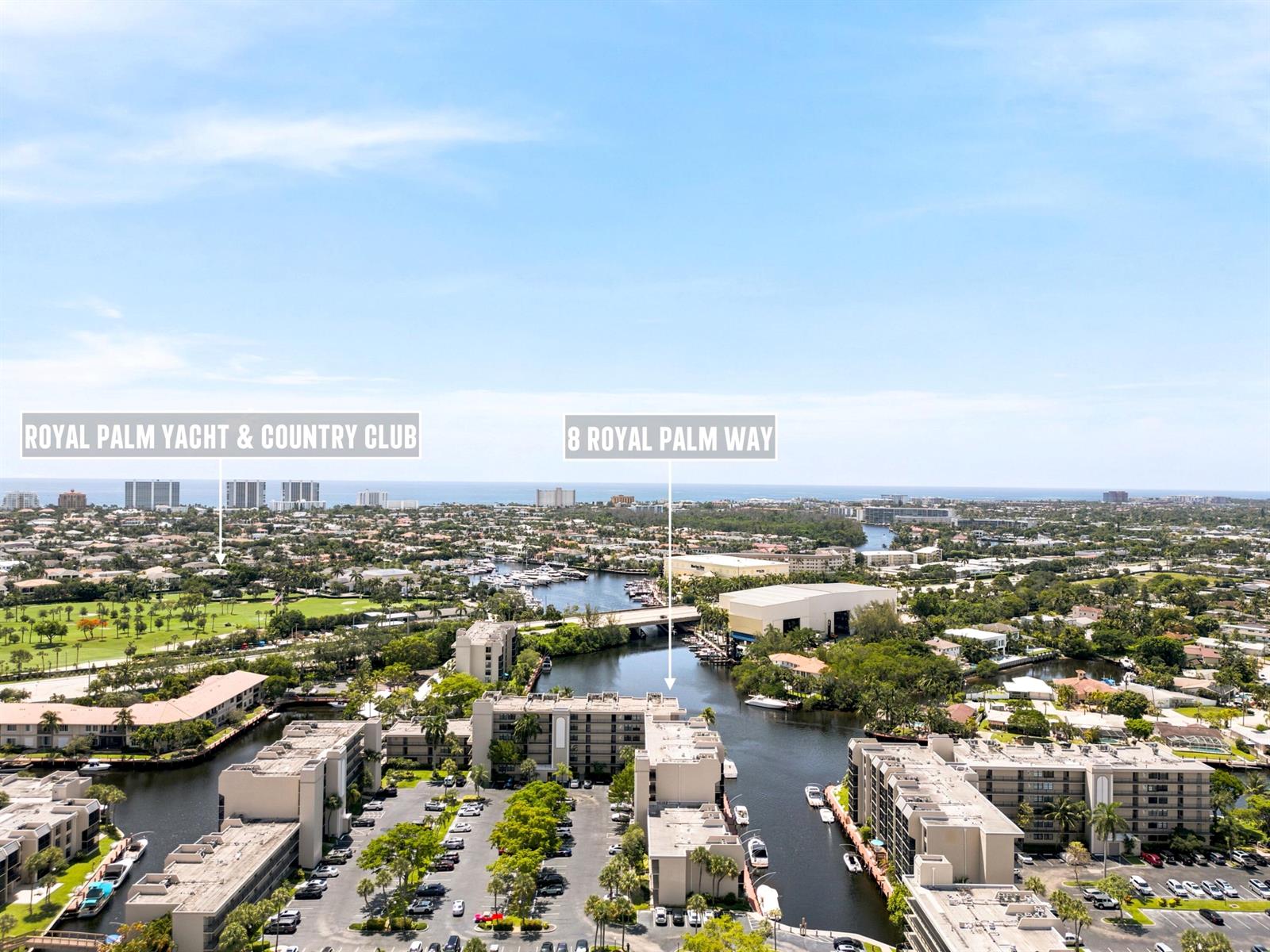 This aerial view shows a waterfront residential complex with a canal and surrounding neighborhood — 8 Royal Palm Way # 3020, Boca Raton FL 33432, BOCA RATON, FL