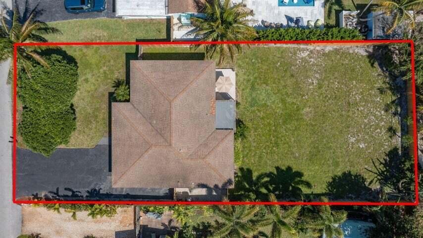 An aerial view shows a house with a brown roof situated on a large lot — 246 NE 14th Street, Delray Beach FL 33444, DELRAY BEACH, FL