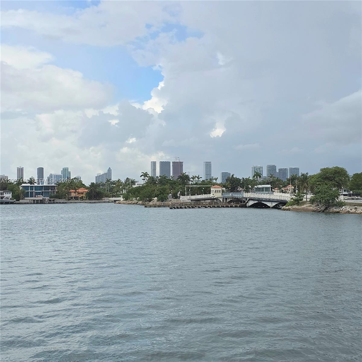 A view of a body of water with a bridge and city skyline in the distance — 5 Island Ave # 5A, Miami Beach FL 33139, MIAMI BEACH, FL