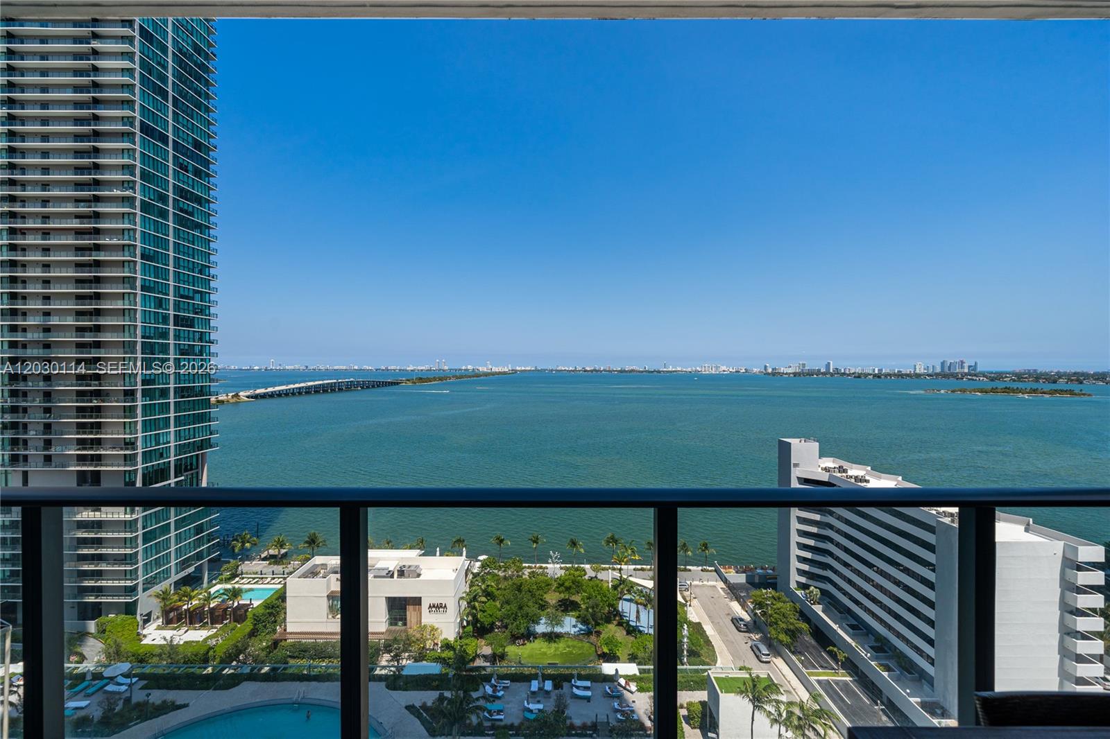A balcony view overlooks a bay, a bridge, a high-rise building, and a park — 480 NE 31st St # 1603, Miami FL 33137, MIAMI, FL