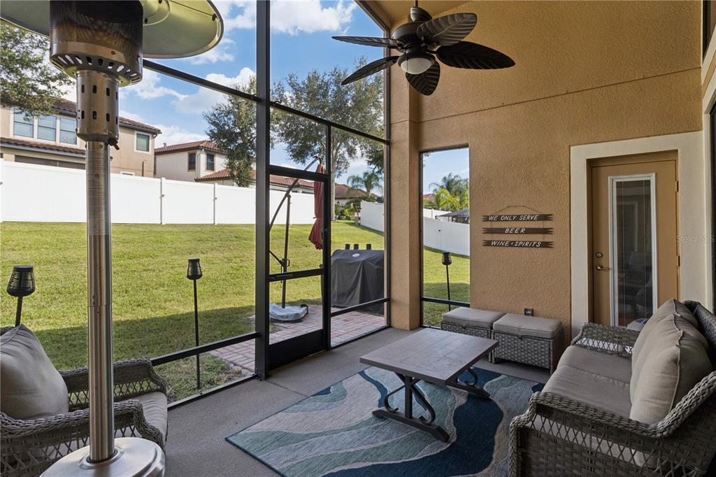 A bright entryway features double glass-paneled doors, a tiled floor, and a large arched window — 3943 SUNSET LAKE DRIVE, LAKELAND, FL