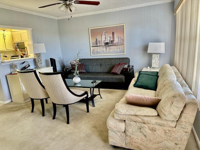 A living room features a beige sofa, two cream chairs, a dark sofa, and artwork — 30 Suffolk A, Boca Raton FL 33434, BOCA RATON, FL