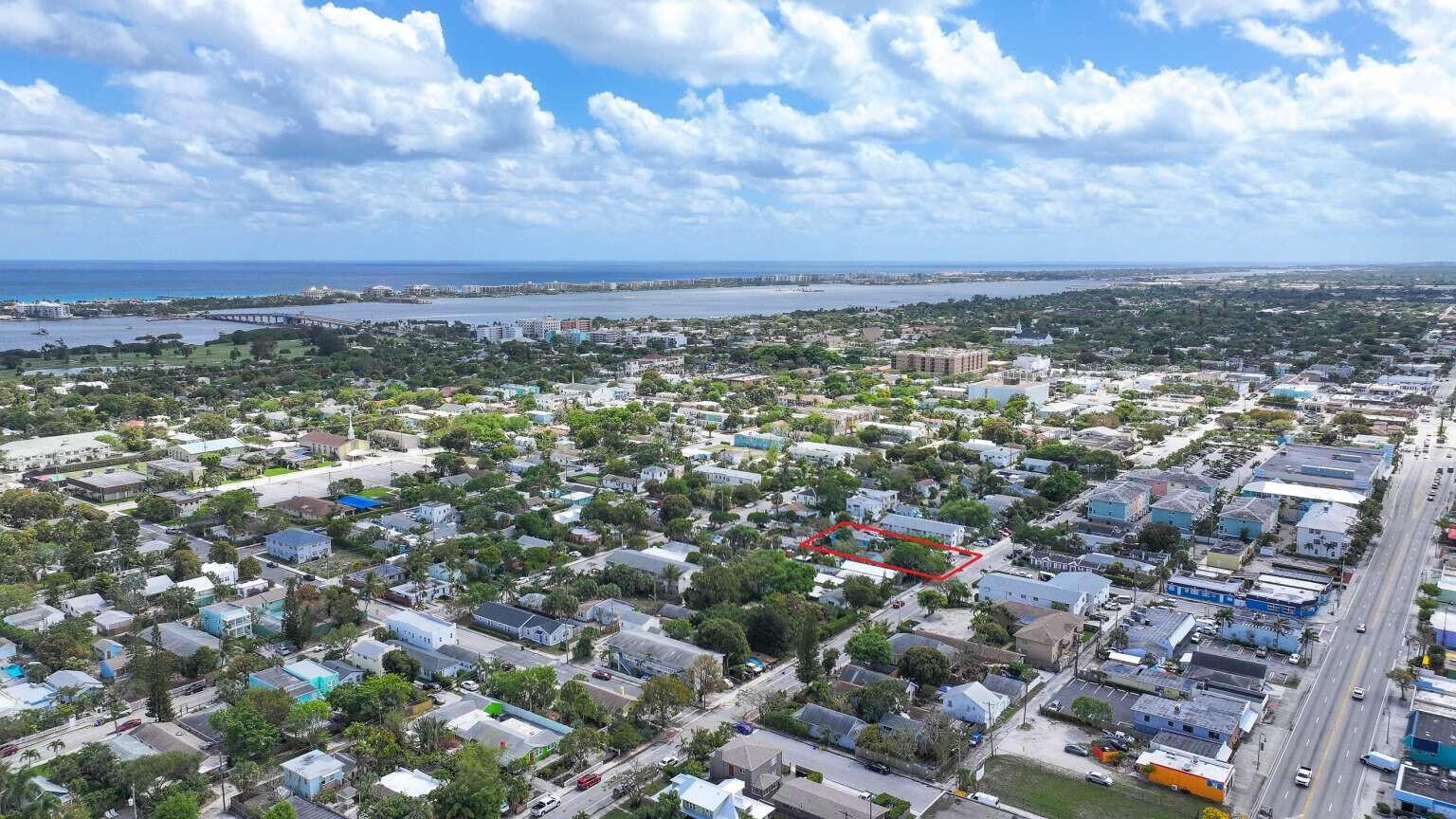 An aerial view shows a residential neighborhood with a red-outlined property in the center — 714 N 4th Ave Avenue N, FL 33460, FL