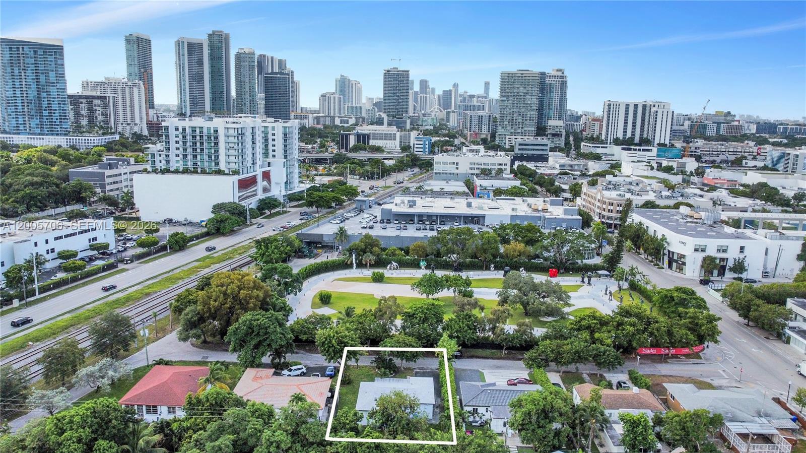 An aerial view shows a small single-story house outlined in white within a residential neighborhood — 231 NE 43rd St, Miami FL 33137, MIAMI, FL