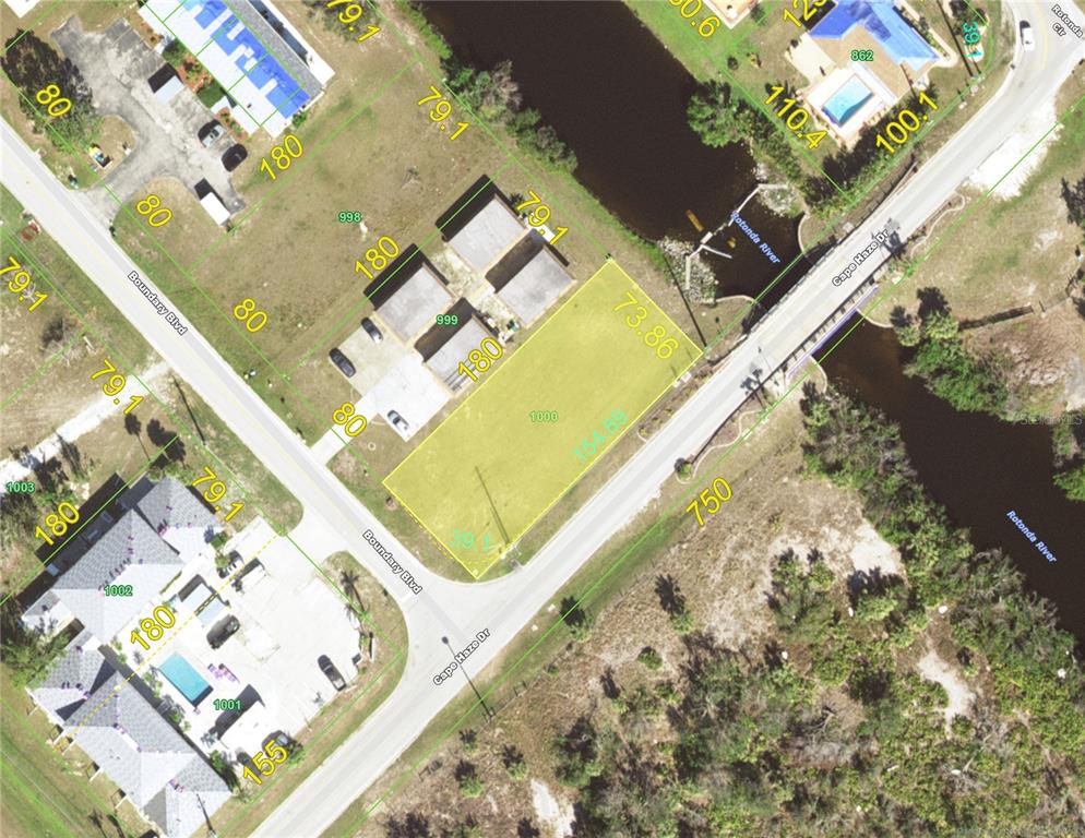 This is an aerial map showing a vacant residential lot highlighted in yellow — 40 BOUNDARY BOULEVARD, ROTONDA WEST, FL