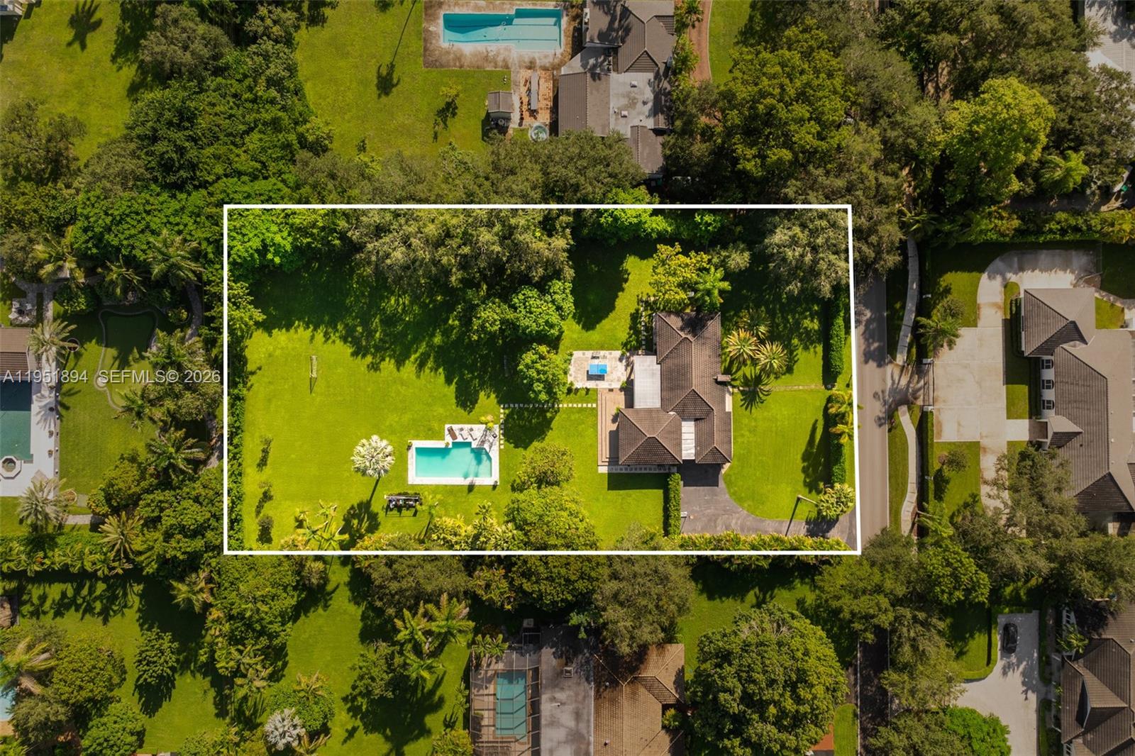 An aerial view shows a house with a swimming pool and large yard — 07325 SW 102nd St, Pinecrest FL 33156, PINECREST, FL