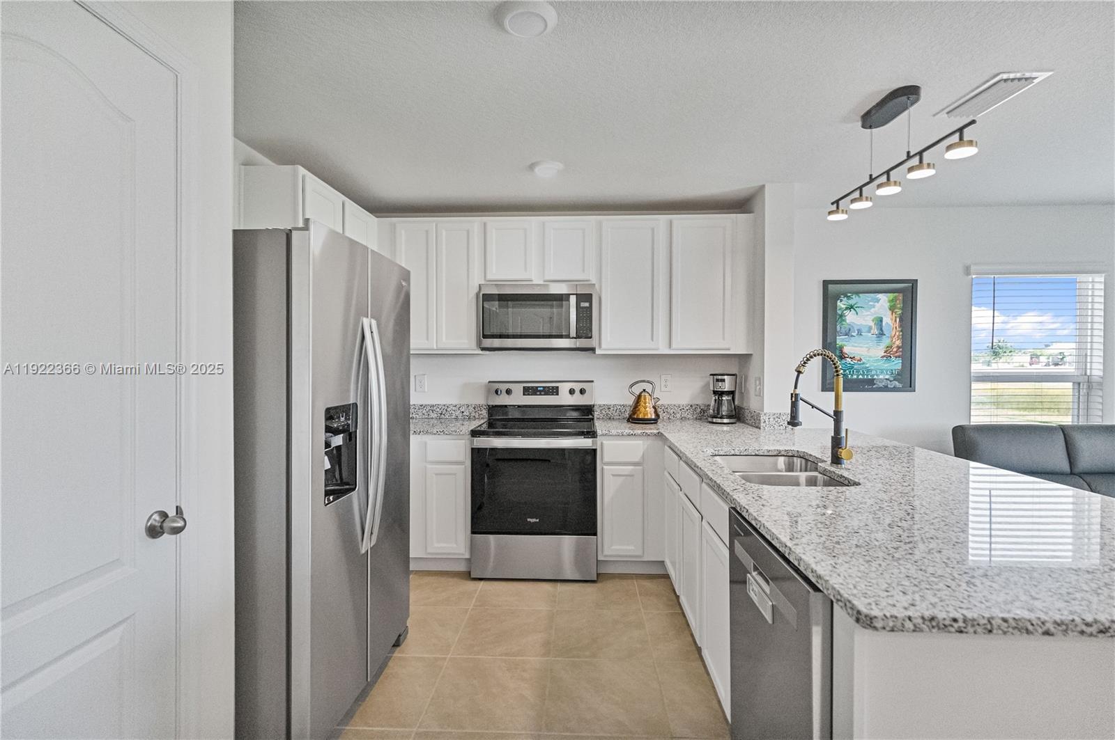 Kitchen with Granite Countertops and Stainless Appliances — SAINT CLOUD, FL