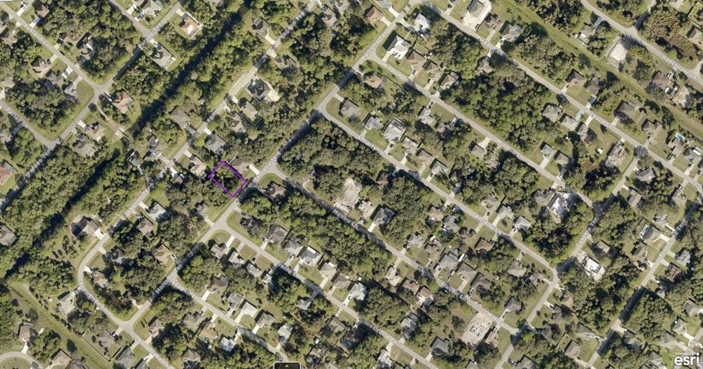 This is an aerial map view showing a vacant residential lot outlined in purple — 1005010428 MARCELLA TERRACE, NORTH PORT, FL