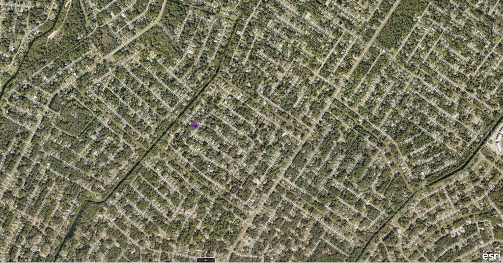 This is an aerial map view of a residential neighborhood with many trees — 1005010428 MARCELLA TERRACE, NORTH PORT, FL