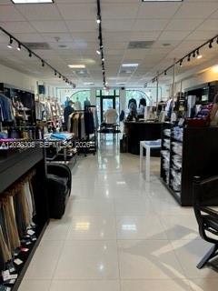 A retail clothing store features tiled floors, recessed lighting, and racks of apparel — 314 Coral Way, Coral Gables FL 33134, CORAL GABLES, FL