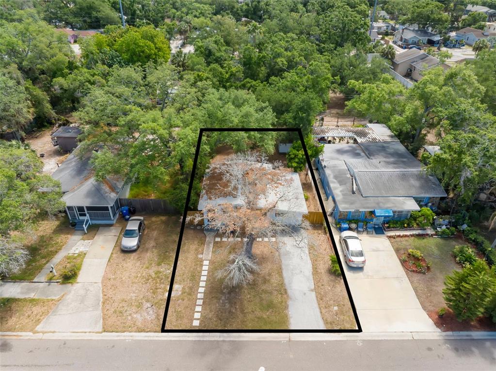 An aerial view shows a single-story house with a large tree in the front yard — 2356 KINGSTON STREET S, ST PETERSBURG, FL