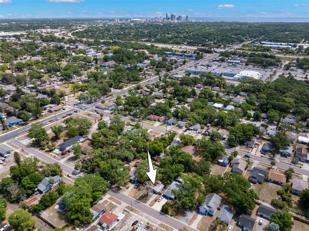 An aerial view shows a single-story house with a white arrow pointing to its roof — 2356 KINGSTON STREET S, ST PETERSBURG, FL