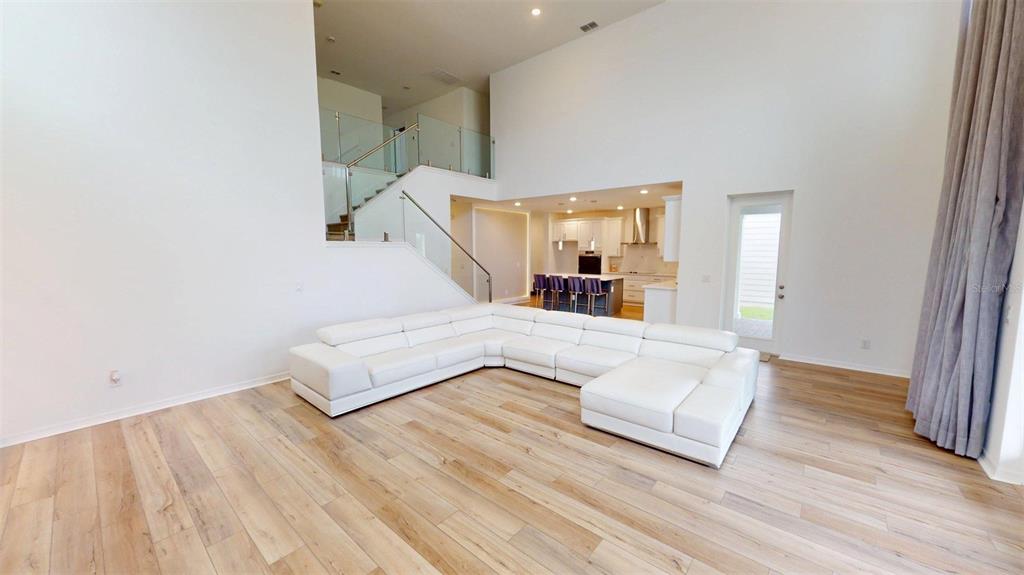 An aerial view shows a two-story house with a shingled roof and a backyard — 17242 LAKE STAR ROAD, WINTER GARDEN, FL
