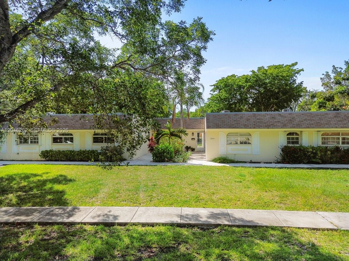 A single-story, light yellow house with a flat roof and a large front lawn — 17244 SW 112th Pl # 21342, Miami FL 33157, MIAMI, FL