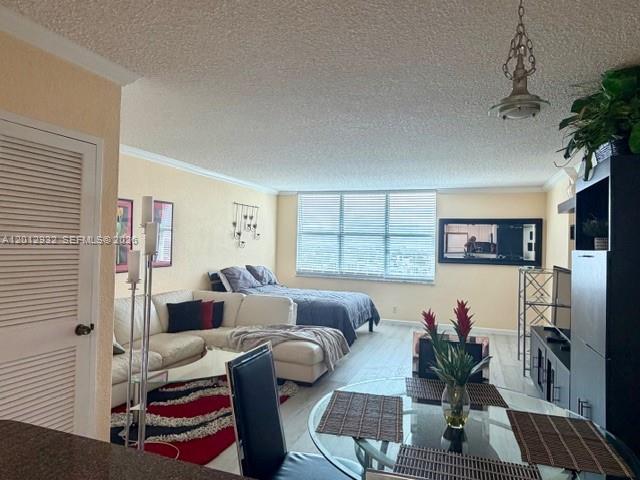 A living room and bedroom combination features a white sofa, bed, and glass dining table — 2501 S Ocean Dr # 1627, Hollywood FL 33019, HOLLYWOOD, FL