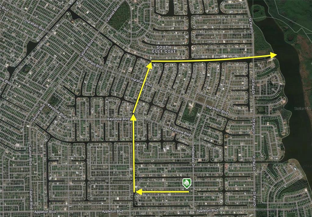 This is a map showing a residential neighborhood with yellow arrows indicating a driving route — 15536 & 15544 HENNIPEN CIRCLE, PORT CHARLOTTE, FL