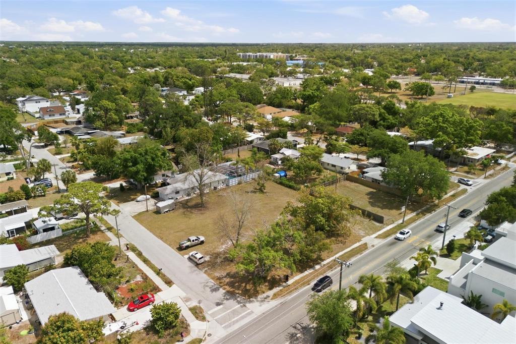 An aerial view shows a vacant residential lot situated between a street and neighboring houses — 0 BAY STREET, SARASOTA, FL