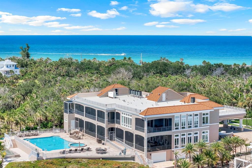 An aerial view of a large multi-story house with a pool and ocean views — 7159 MANASOTA KEY ROAD, ENGLEWOOD, FL