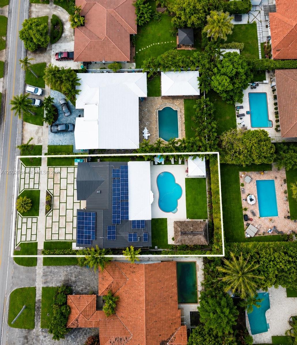 An aerial view shows a residential property with solar panels, a swimming pool, and landscaping — 12440 SW 96th St, Miami FL 33186, MIAMI, FL
