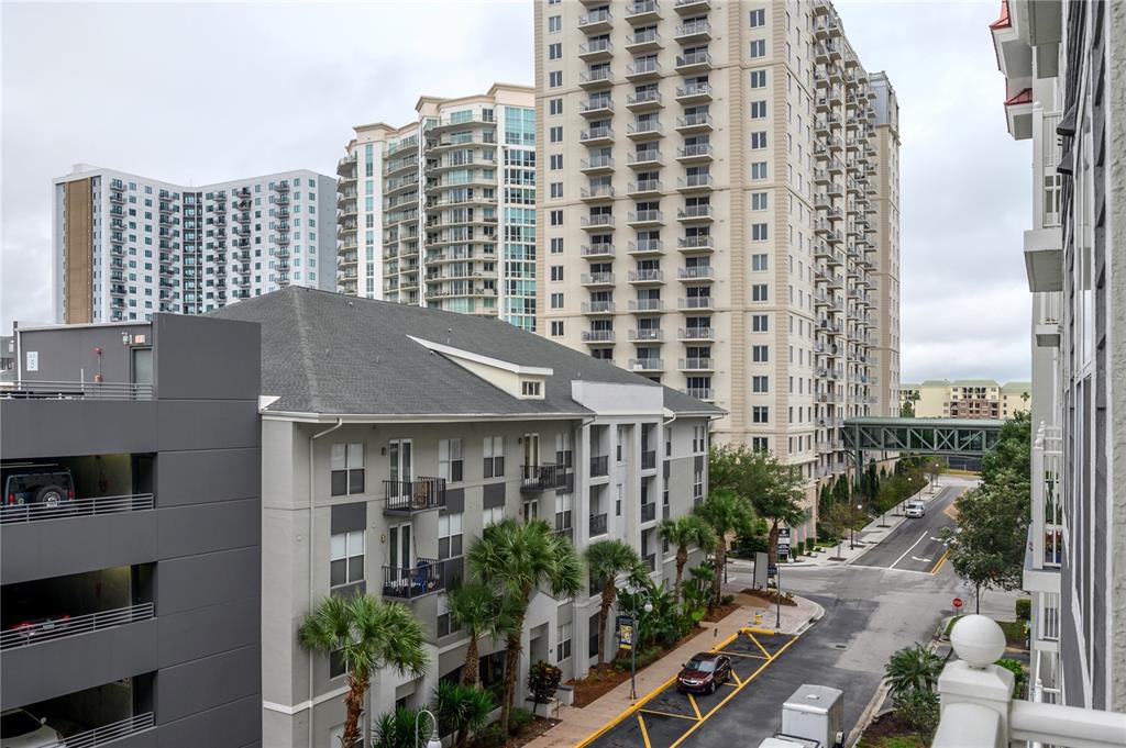 An elevated view shows a multi-story apartment complex with a parking garage and street — 700 S HARBOUR ISLAND BOULEVARD UNIT 436, TAMPA, FL
