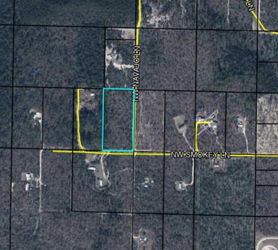 This is an aerial map showing a rectangular plot of land outlined in light blue — Xxxx NW Smokey Lane NW, FL 32438, FL