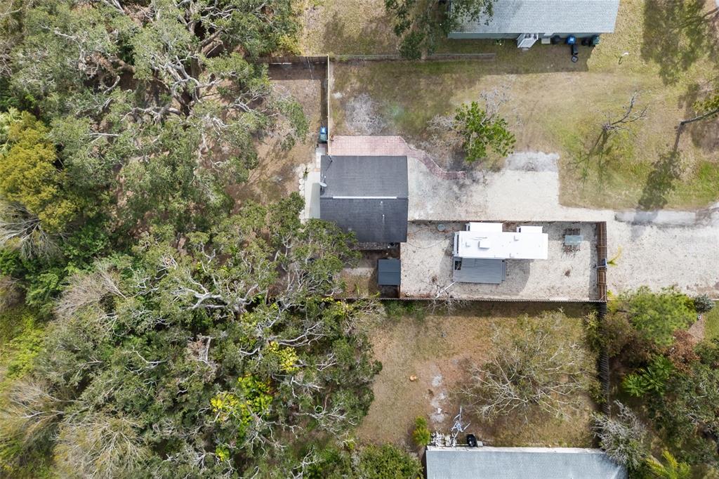 An aerial view shows a house, a detached RV, and a large tree-covered yard — 3200 TOBERO LANE, SARASOTA, FL