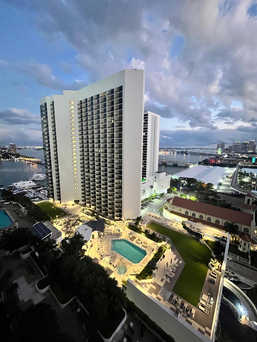 An aerial view of a high-rise apartment building with a pool and surrounding grounds — 1717 N Bayshore Dr # 2453, Miami FL 33132, MIAMI, FL