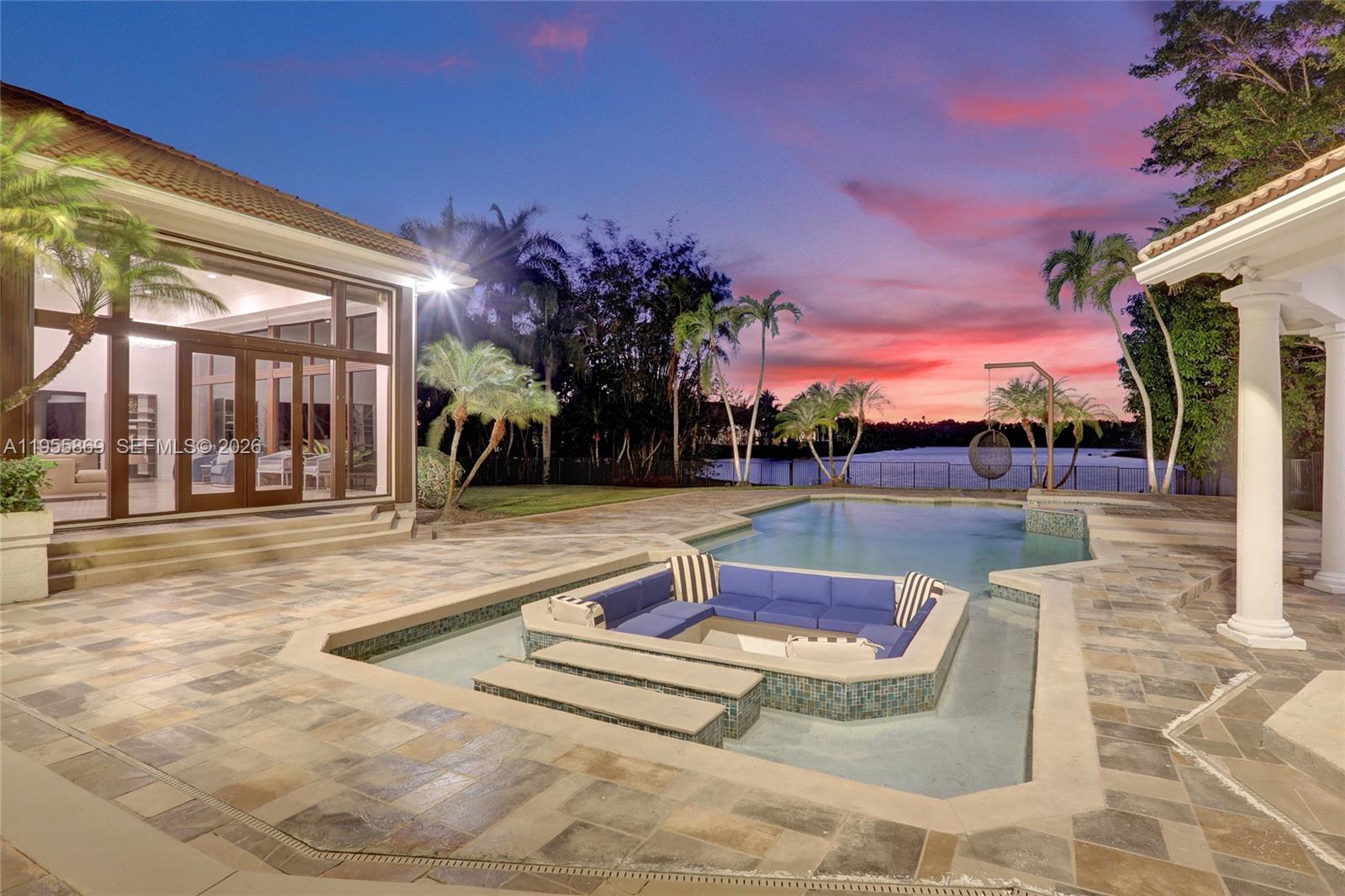 An aerial view shows a large house with a tiled roof, circular driveway, and fountain — 3175 Hunter Road, Weston FL 33331, WESTON, FL