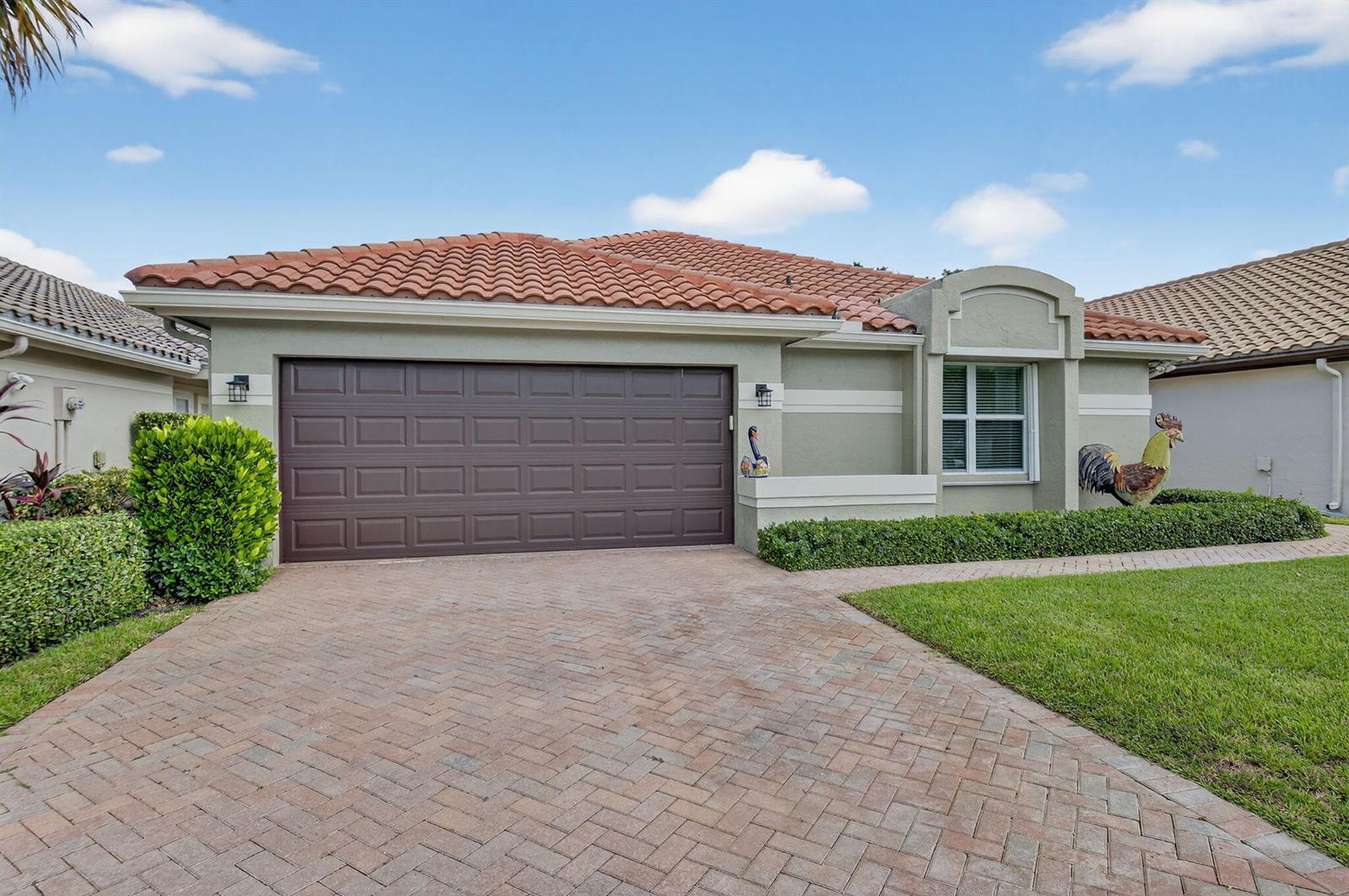 A single-story house with a brown garage door, tile roof, and a paved driveway — 11270 Clover Leaf Circle, Boca Raton FL 33428, BOCA RATON, FL