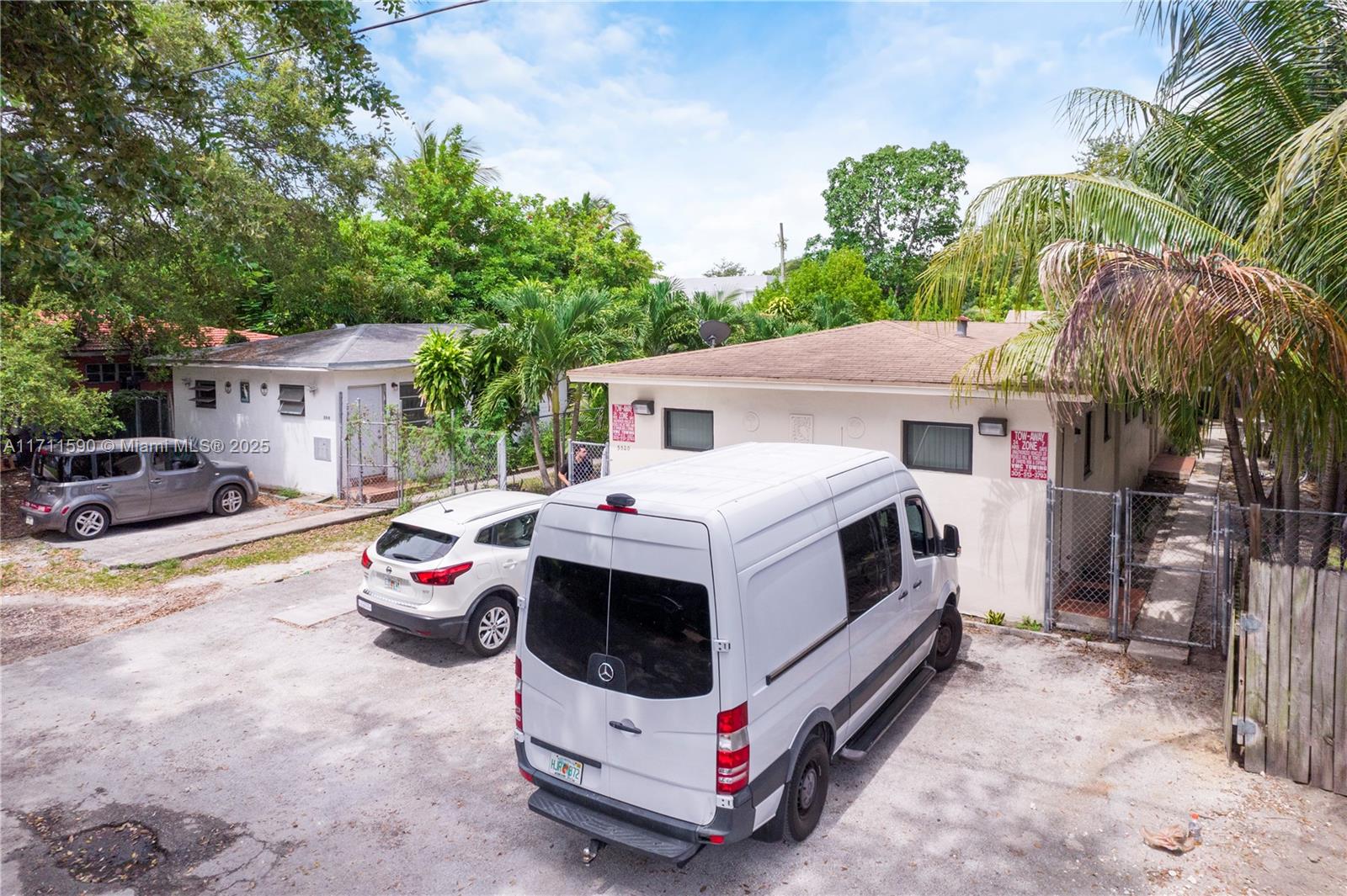 An exterior view shows a white van and a car parked in front of two houses — 5520 NE 1st Ct, Miami FL 33137, MIAMI, FL
