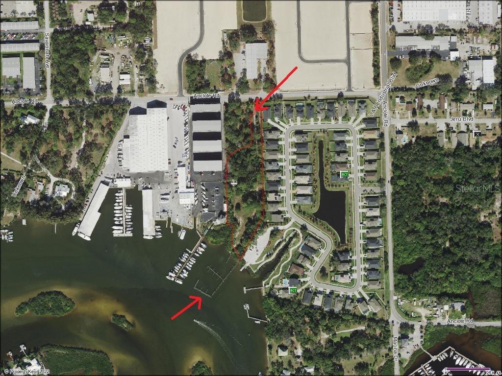 This is an aerial map showing a waterfront property parcel outlined in red — 507 ANCLOTE ROAD, TARPON SPRINGS, FL