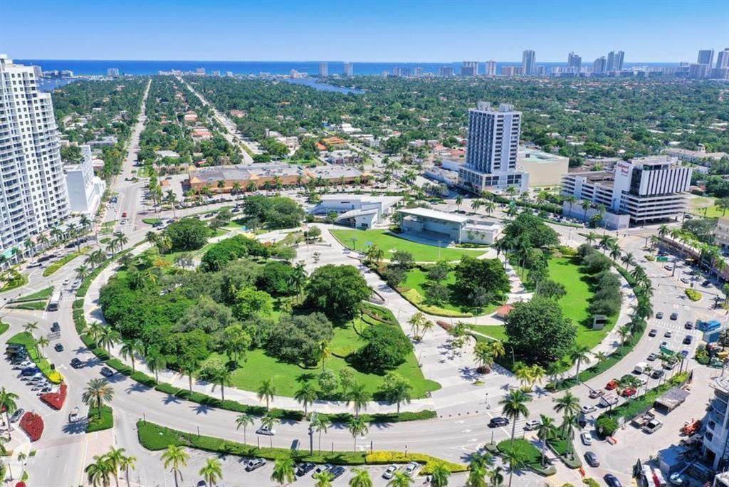 Aerial view of a circular park surrounded by city streets, buildings, and palm trees — 1830 Radius Drive # 225, Hollywood FL 33020, HOLLYWOOD, FL