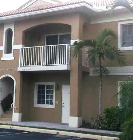 A kitchen with white cabinets, stainless steel appliances, and light-colored tile flooring — 4812 Washington St # 147, Hollywood FL 33021, HOLLYWOOD, FL